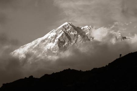 Climber with Lobuje as backdrop, Nepal